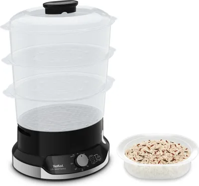 A Tefal Ultracompact Steamer with a bowl of rice next to it.