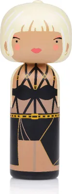 A stylized wooden figurine of a woman.