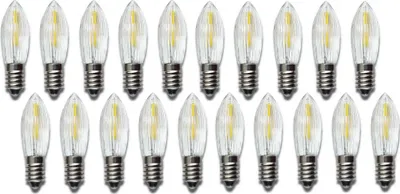 A collection of LED filament light bulbs arranged in rows on a white background.
