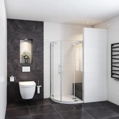 A modern bathroom with a toilet, shower cabin, and a towel rack.