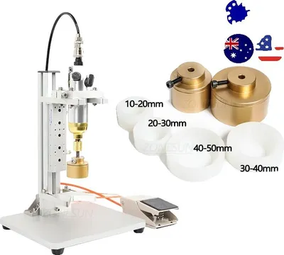 A pneumatic capping machine with various chucks and flags of Australia and the USA.