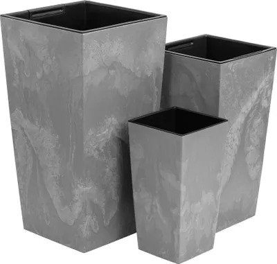 Three gray planters of different sizes are arranged in a group.