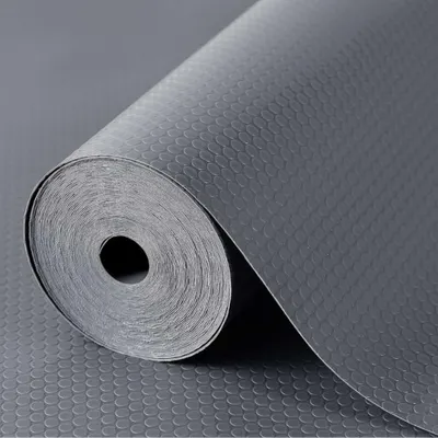 A roll of gray anti-slip mat with a honeycomb pattern.