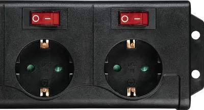 A close-up shot of a black power strip with two outlets and two red switches.