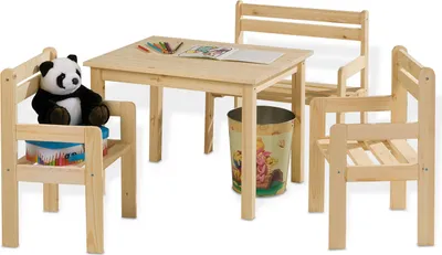 A wooden children's table and chairs set with a stuffed panda on one of the chairs.