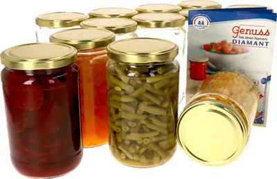 A collection of glass jars filled with preserved food items, with a product box in the background.