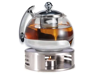 Produktbild von Gravidus Tee-Set mit Teekanne und Stövchen, 1,2 Liter, aus hitzebeständigem Glas und Edelstahl. Inklusive integriertem Teesieb, Filterhalterung und Teelichthalter für optimale Wärmeverteilung. Mattes, zeitloses 2er-Set. Maße: Kanne 18x15x14 cm (BxTxH), Stövchen 15x5 cm (ØxH).