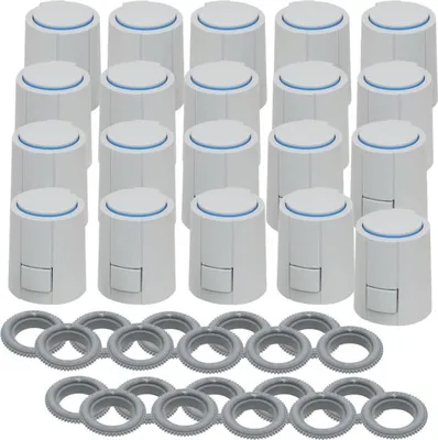 A collection of white thermostat heads and gray rings arranged on a white background.