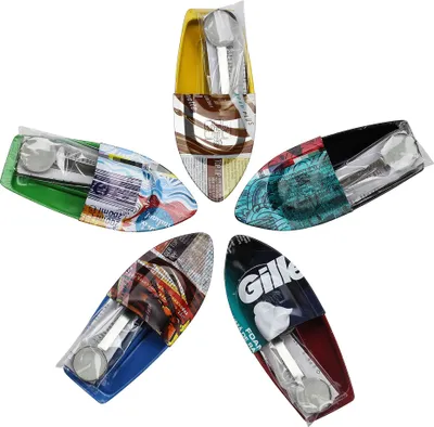 A collage of five toy tin boats, each with different colorful packaging.