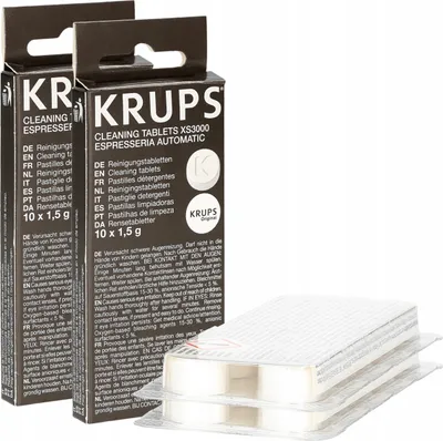 Two boxes of Krups cleaning tablets for espresso machines, with a plastic package of the tablets in the foreground.