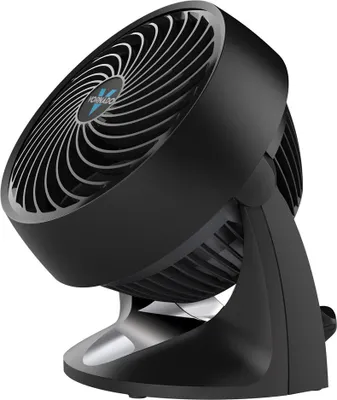 A black desk fan is shown on a white background, viewed from a three-quarter side angle.