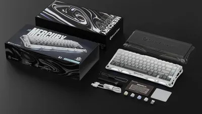 A product shot of a mechanical keyboard and its packaging, laid out on a black surface.