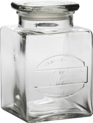 A clear studio shot of a glass storage jar with a lid.