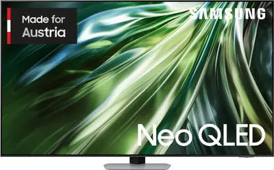 A Samsung Neo QLED TV is displayed with a green and white abstract background. The screen shows the 'Neo QLED' logo and the Samsung logo. A small black rectangle with the text 'Made for Austria' is in the top left corner.