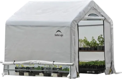 A white greenhouse with plants inside, shown on a white background.