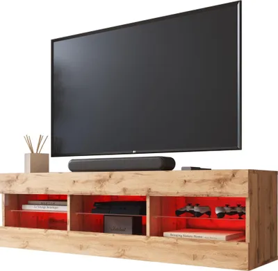 A TV stand with a TV and soundbar on top, and various items inside the compartments.