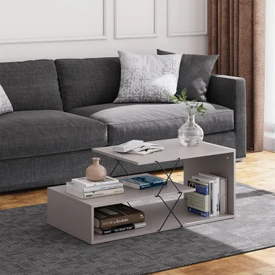 A coffee table in a living room setting with a sofa and rug.