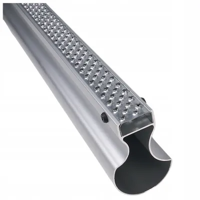 A close-up, angled view of a silver aluminum facade raspel with a textured surface, set against a plain white background.