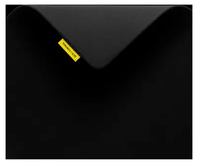 A black mousepad with a small yellow tag.