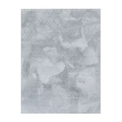 A flat lay image of a rug with a geometric pattern.