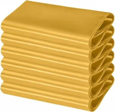 A stack of folded gold satin fabric.