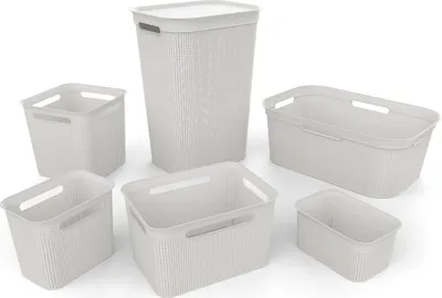 A collection of white laundry baskets of various sizes and shapes, arranged on a white background.