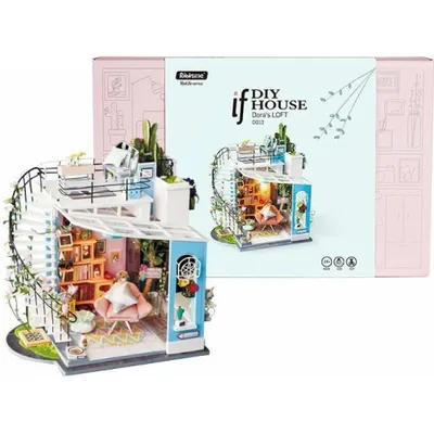A miniature DIY dollhouse kit of a loft apartment, displayed next to its packaging.
