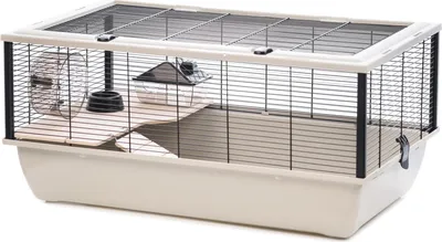 A hamster cage with accessories on a white background.