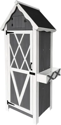 A tall, narrow garden storage cabinet with a pitched roof, a door with decorative white cross-hatching, and a small shelf on the side.