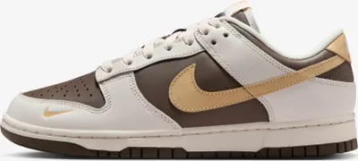 A side view of a Nike Dunk Low sneaker.