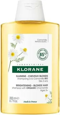 A bottle of Klorane shampoo with chamomile.