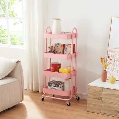 A pink four-tiered rolling cart filled with various items, placed in a room next to a sofa and a cabinet.