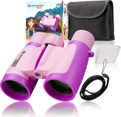 A pair of pink and purple junior binoculars is displayed prominently, along with its packaging and accessories.