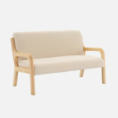 A beige bouclé children's bench with wooden legs and arms, presented against a white background.