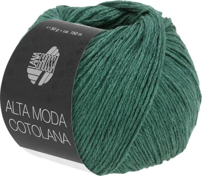 A ball of dark green yarn with a black label wrapped around it.