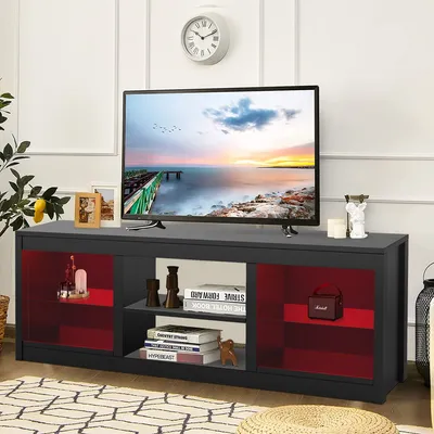 A TV stand with a television on top, placed in a living room setting.