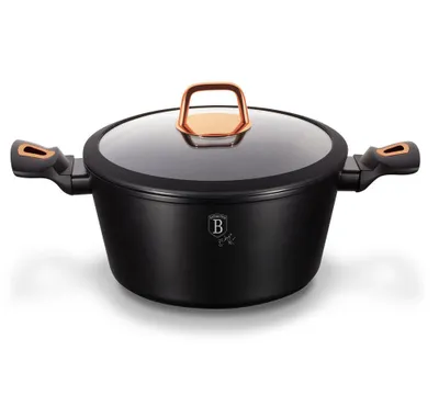 A black cooking pot with copper accents and a glass lid, shown on a white background.