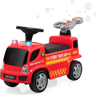 A red toy fire truck with a steering wheel, lights, and a bubble gun on a white background.