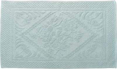A light blue bath mat with a raised floral pattern.