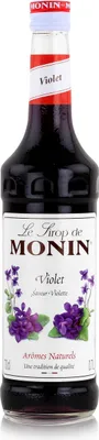 A bottle of Monin Violet syrup against a white background.