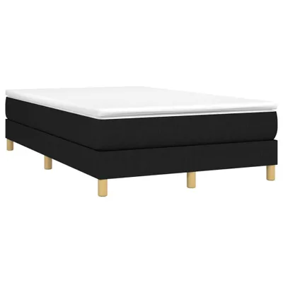 A black boxspring bed frame with a white mattress on top, supported by four wooden legs, presented against a white background.