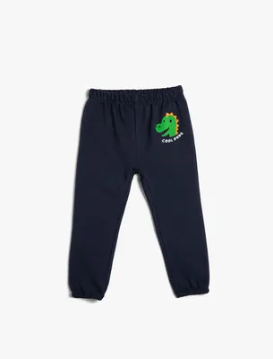 Immagine prodotto di Pantaloni da jogging per bambini Koton, modello Babyboy, con elastico in vita e stampa a tema dinosauri