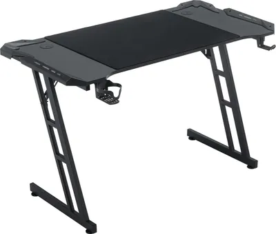 A black and gray gaming desk with a Z-shaped frame, shown from a slightly elevated front-left angle against a white background.