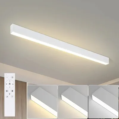 A white LED ceiling light fixture mounted on a light-colored ceiling, with a remote control shown in the lower left corner and close-up views of the light's illumination.