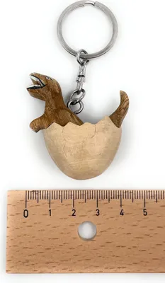 Immagine prodotto di Onwomania Dinosauro TRex in uovo Portachiavi in legno fatto a mano, portafortuna in scatola regalo in alluminio, ideale come regalo