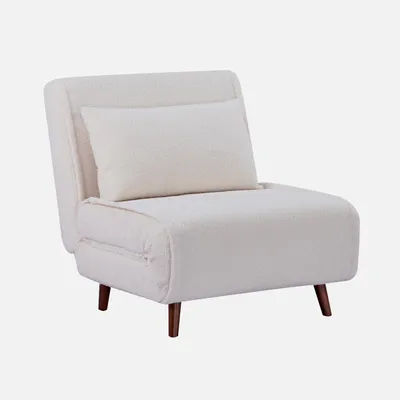 A cream-colored armchair with a bouclé fabric cover and a small pillow, shown from a three-quarter angle on a light gray background.