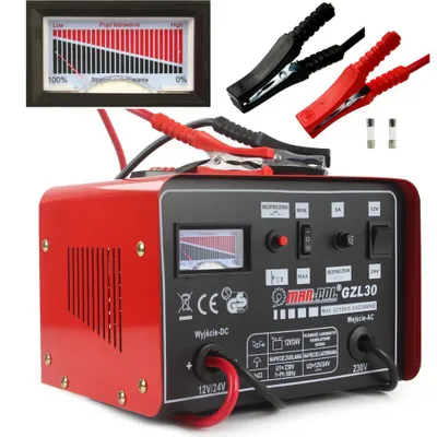 A red and black battery charger with accessories and a gauge.