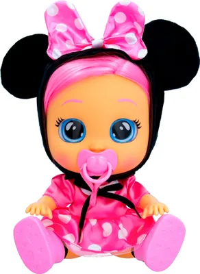 A doll dressed as Minnie Mouse, sitting down.