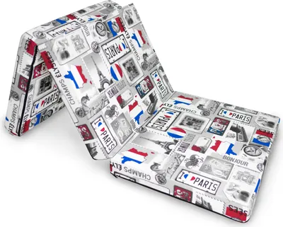 A folded mattress with a Paris-themed print.