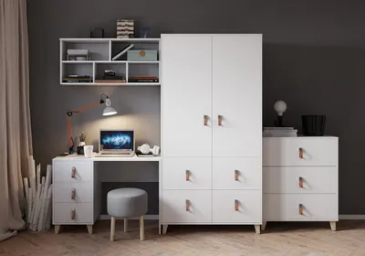 A modern white bedroom set for children or teenagers, including a wardrobe, chest of drawers, desk with a stool, and a wall shelf.